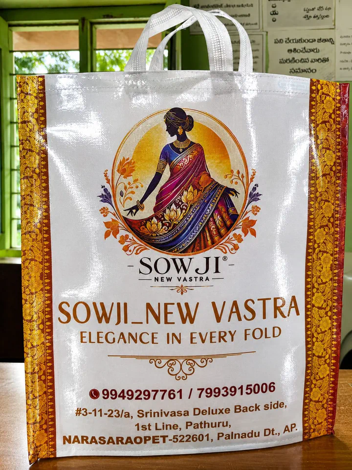 Glossy BOPP laminated non woven bag with a full colour saree shop print and orange side panels