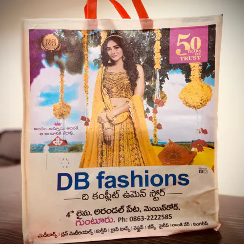 Laminated loop handle shopping bag with full colour photographic printing, made for a womenswear store