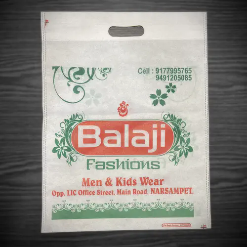 D-cut white non woven carry bag with two colour green and red printing, made for a menswear shop